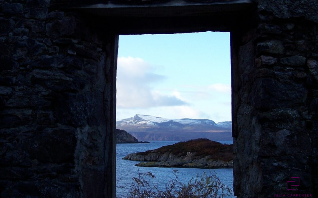 Looking through doorway at mountains, water, and islands